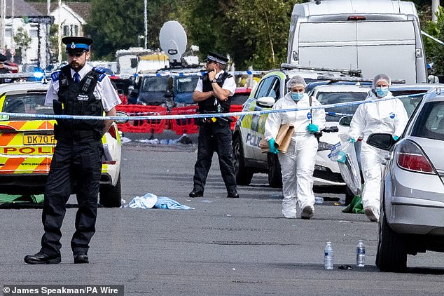 Police on Hart Street Southport, Merseyside, immediately after the attack in July last year