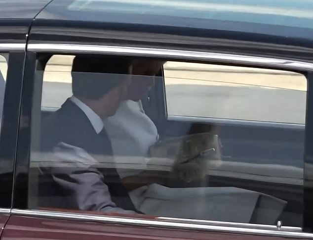 The French couple appeared to remain frosty in the car today as Brigitte looked inside her handbag