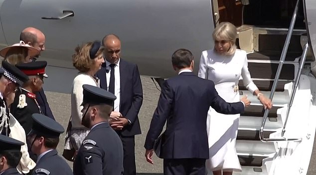 As Mrs Macron approached her husband at RAF Northolt, she still declined to take his hand