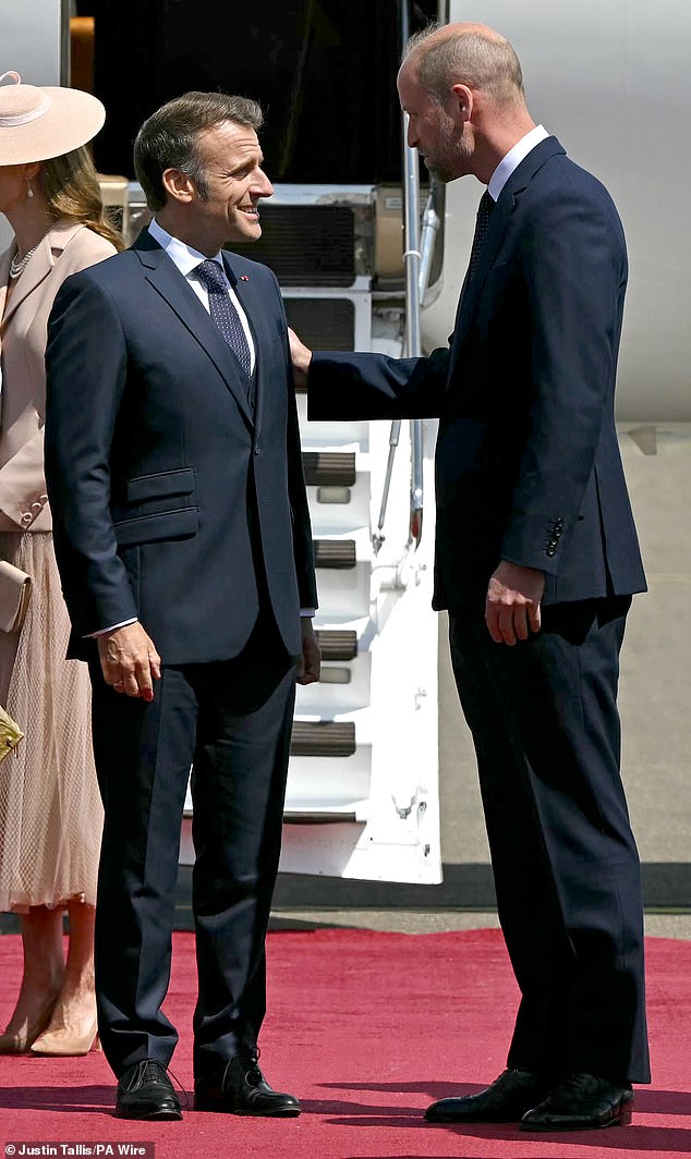 French President Emmanuel Macron is welcomed by the Prince of Wales at RAF Northolt today