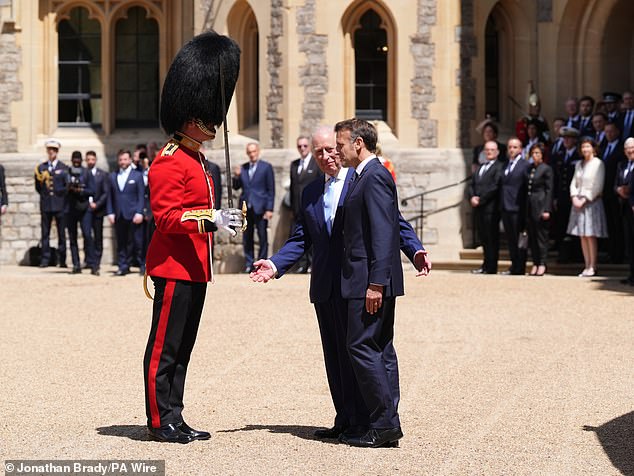 Emmanuel Macron and King Charles III inspect the Guard of Honour at Windsor Castle today