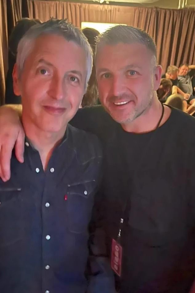 Kelbie, who is now a boxing promoter, also posed with with Oasis guitarist Gem Archer (left)