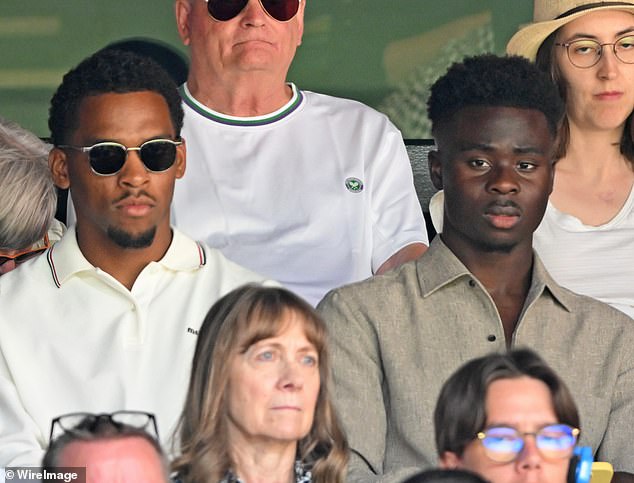 Bukayo Saka (right) and Jurrien Timber (left) watch on as Norrie faces off against Alcaraz