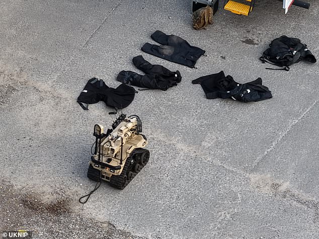 Protective clothing as well as a robot used by the bomb squad was also seen outside the pub