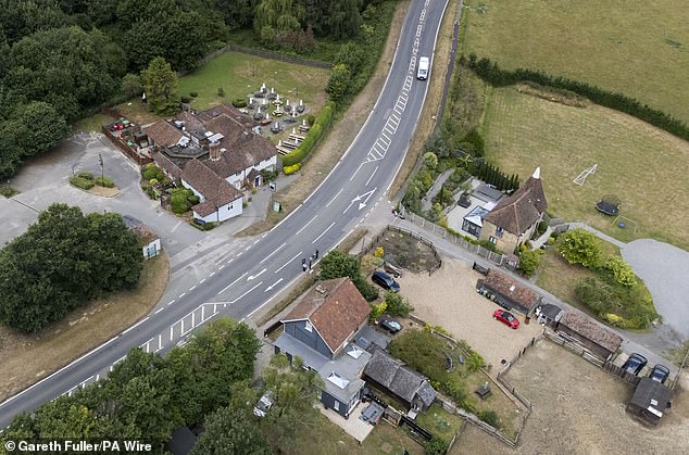 A general view of the Park Gate Inn (top left of pic) in Hollingbourne, near Maidstone, Kent