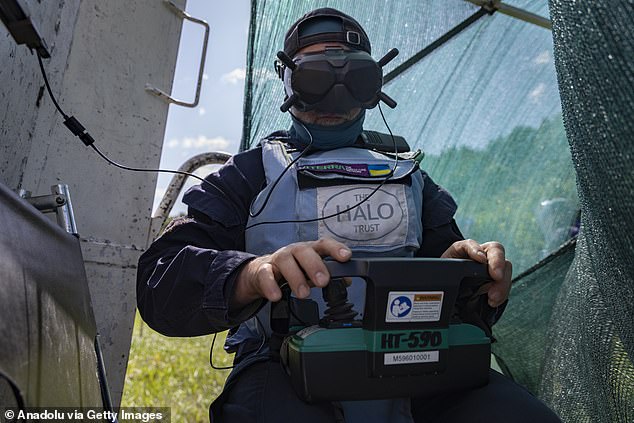 A team of deminers from the HALO Trust (a British charity and American non-profit organization dedicated to the removal of landmines and unexploded ordnance) clear explosive ordnance on the outskirts of the village of Budy, which was left behind during Russia-Ukraine war in early 2022 in Kharkiv, Ukraine