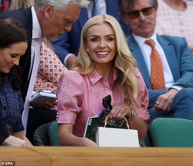 Mezzo-soprano Katherine Jenkins was pretty in pink as the Welsh singer joined the crowds for another action-packed day in Wimbledon