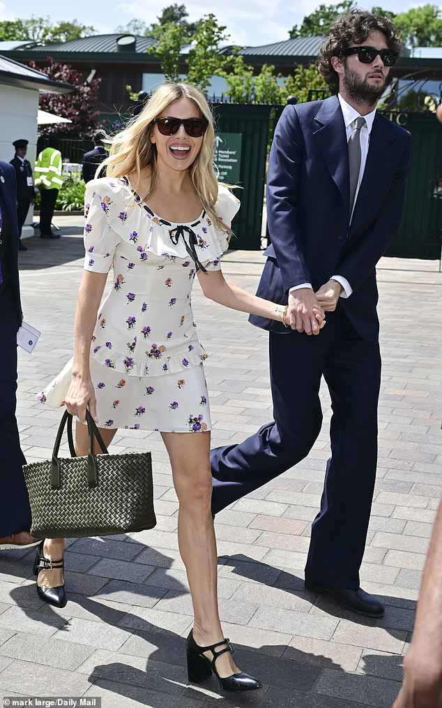 Sienna picked a £1,425 thigh-skimming floral dress from Alessandra Rich as she arrived on the arm of Oli, 28