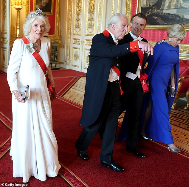 President Macron looked to be in high spirits as he chatted with the King ahead of the state banquet