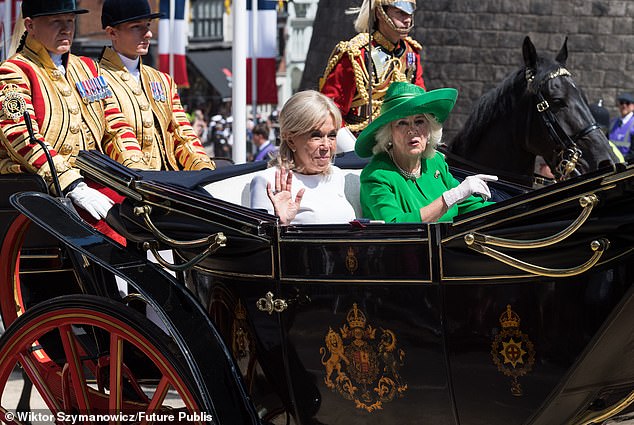 Brigitte Macron and Queen Camilla travel in a Semi-State Landau through Windsor today