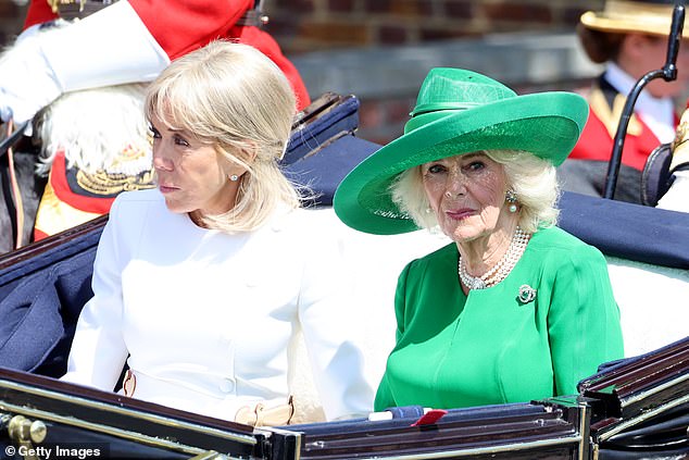 Brigitte Macron and Queen Camilla travel in a Semi-State Landau through Windsor today