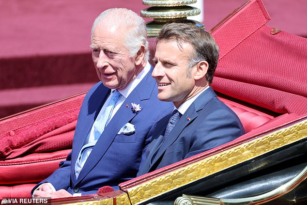 King Charles III and Emmanuel Macron travel in a 1902 State Landau through Windsor today