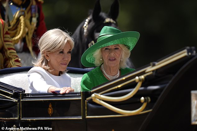 Brigitte Macron and Queen Camilla travel in a Semi-State Landau through Windsor today