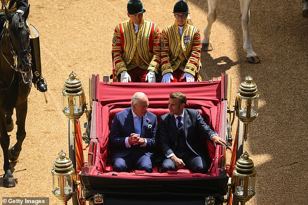 King Charles III and Emmanuel Macron travel in a 1902 State Landau through Windsor today