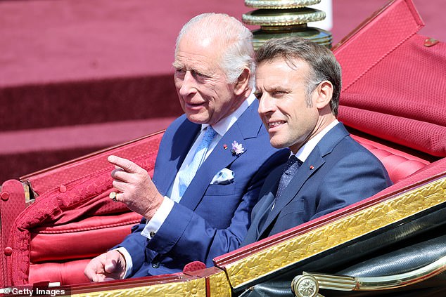 King Charles III and Emmanuel Macron travel in a 1902 State Landau through Windsor today