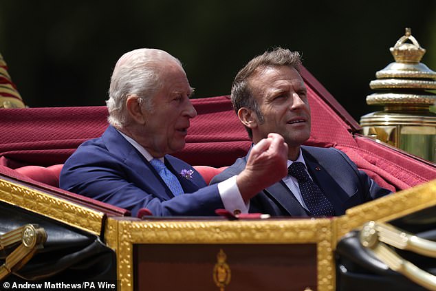 King Charles III and Emmanuel Macron travel in a 1902 State Landau through Windsor today