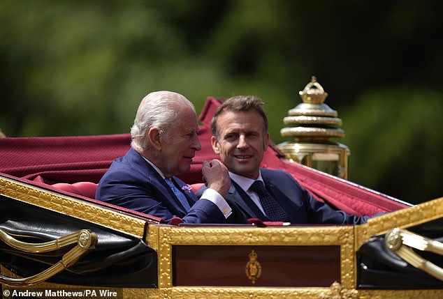 King Charles III and Emmanuel Macron travel in a 1902 State Landau through Windsor today