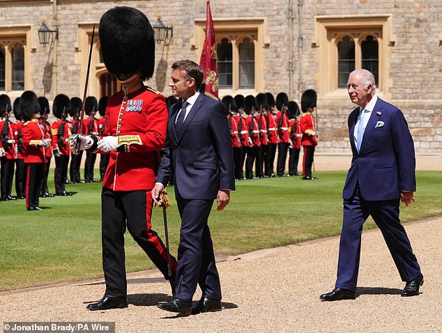 Emmanuel Macron and King Charles III inspect the Guard of Honour at Windsor Castle today