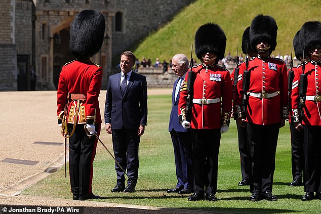 Emmanuel Macron and King Charles III inspect the Guard of Honour at Windsor Castle today