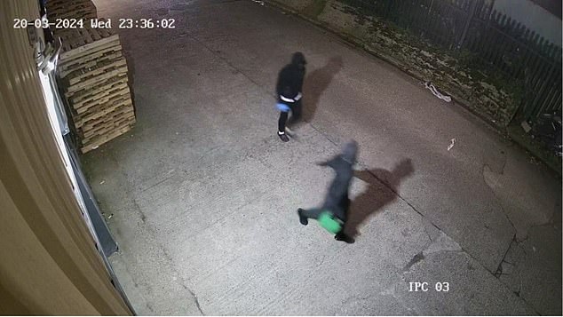 Pictured are Mensah and Rose carrying a Jerry can of fuel used to help ignite the fire