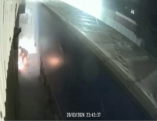 The attack was caught on CCTV as the gang ran away. A fire can be seen in the background