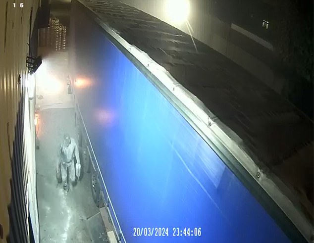 A lorry driver was later caught on camera attempting to extinguish the blaze at the unit
