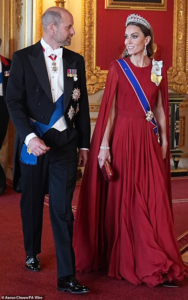Kate, 43, was the picture of poise in a dramatic dark red silk creponne gown, designed by Sarah Burton for Givenchy