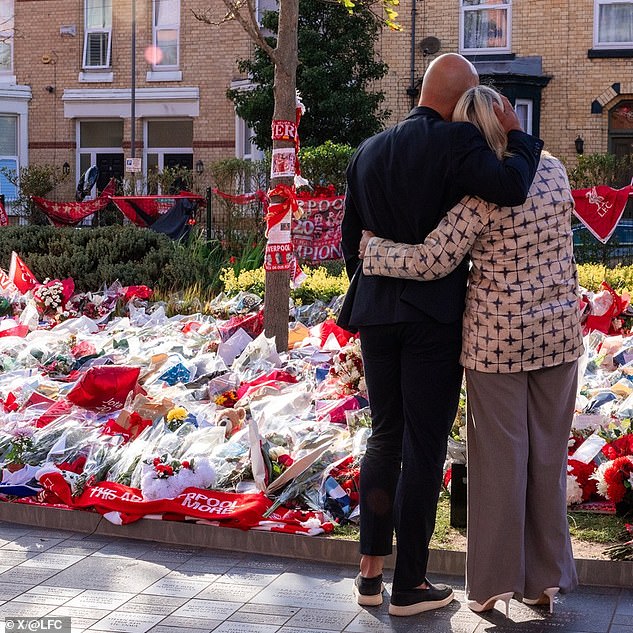 The Reds boss and his wife shared a touching embrace as they added to the tributes to the brothers