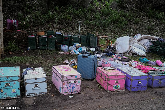 Campists' belongings lie on the ground following flooding on the Guadalupe River
