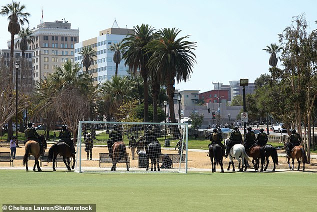 On Monday, immigration agents were spotted roaming through downtown LA (pictured). Some of them were riding horses, while others traveled on foot