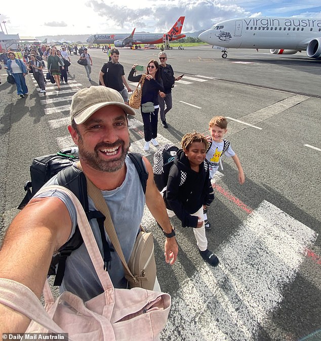 Clint Williams (pictured) was on the Sydney-bound flight from Vanuatu when Australian Federal Police officers boarded the aircraft on Saturday night