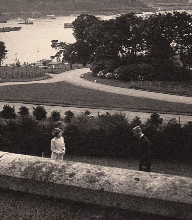 A young Philip and Elizabeth at Dartmouth. Philip then briefly chaperoned the young royal during her visit to the naval college where they 'played with toy trains and leapt over a tennis net'