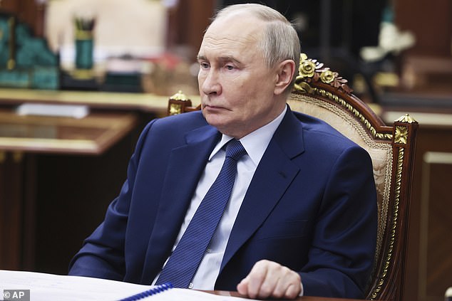 Russian President Vladimir Putin speaks with Yuri Chikhanchin, the Director of the Federal Financial Monitoring System, at the Kremlin in Moscow, Russia, Tuesday, July 8, 2025