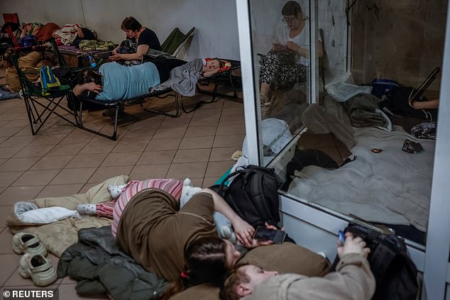 People take shelter inside a metro station during an air raid alert amid Russia's attack on Ukraine, in Kyiv, Ukraine, July 9, 2025