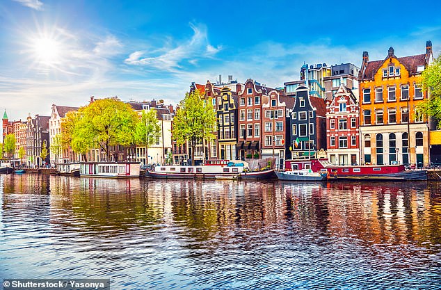 A British tourist died after sitting on a window sill and 'falling backwards' on a family holiday in Amsterdam (file image: Amsterdam)