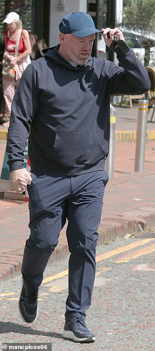 Rooney was seen making his way inside a local barber shop after parking his car on Tuesday