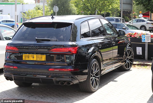 The distinctive disabled parking sign was within touching distance of Rooney's fender