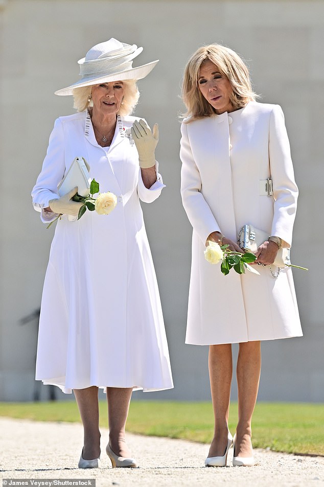 The Queen and the French First Lady, both dressed in white, at the memorial in June 2024