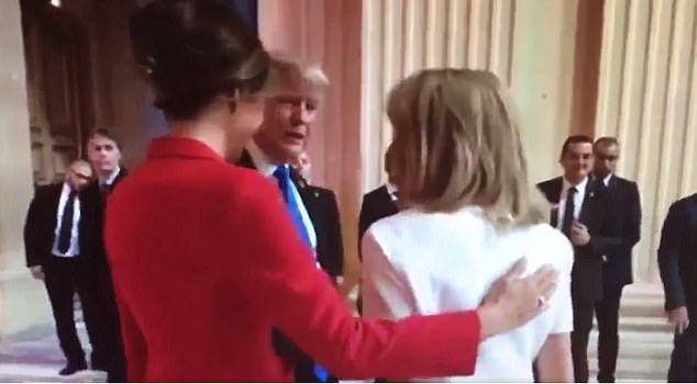 Melania Trump put her hand around Mrs Macron protectively as President Trump spoke to her