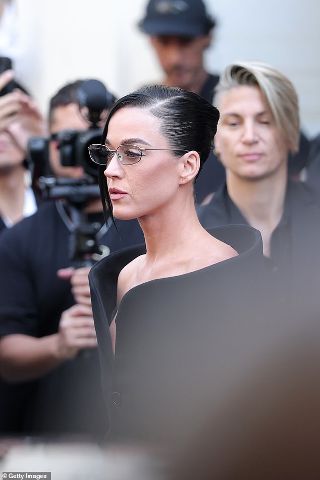 She swept her brunette tresses back