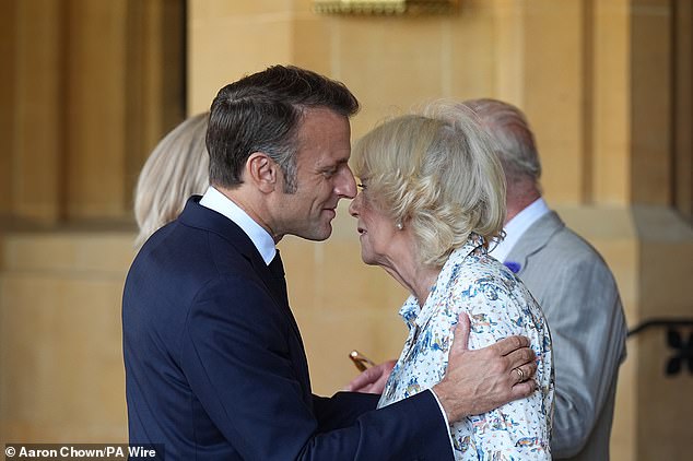 Emmanuel Macron is seen bidding farewell to Queen Camilla following the morning visit to the grounds of Windsor Castle