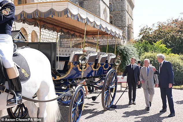 King Charles III and Emmanuel Macron view the Charabanc carriage, which was gifted to Queen Victoria by King Louis-Philippe of France in 1844
