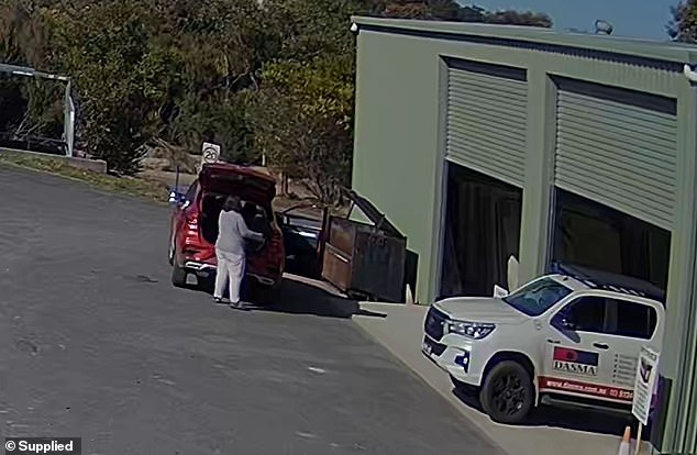 And she was seen struggling to take it inside to be recycled with other e-waste