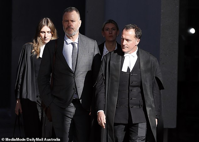 Patterson's barrister Colin Mandy SC is pictured right