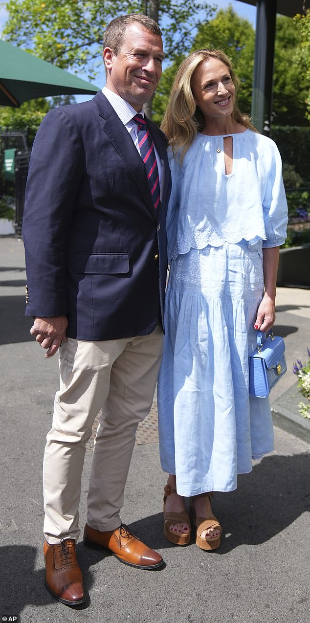 Pictured: Peter Phillips and Harriet Sperling pose for photographers as they arrive for day ten at the Wimbledon Tennis Championships in London