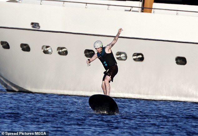 Brooklyn was spotted larking around on a hoverboard