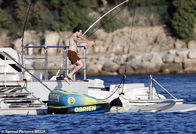 Brooklyn entertained himself jumping off the boat and into the water