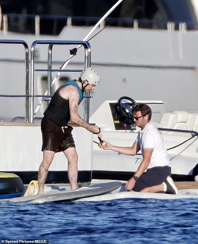 He was helped by a member of the boat's crew