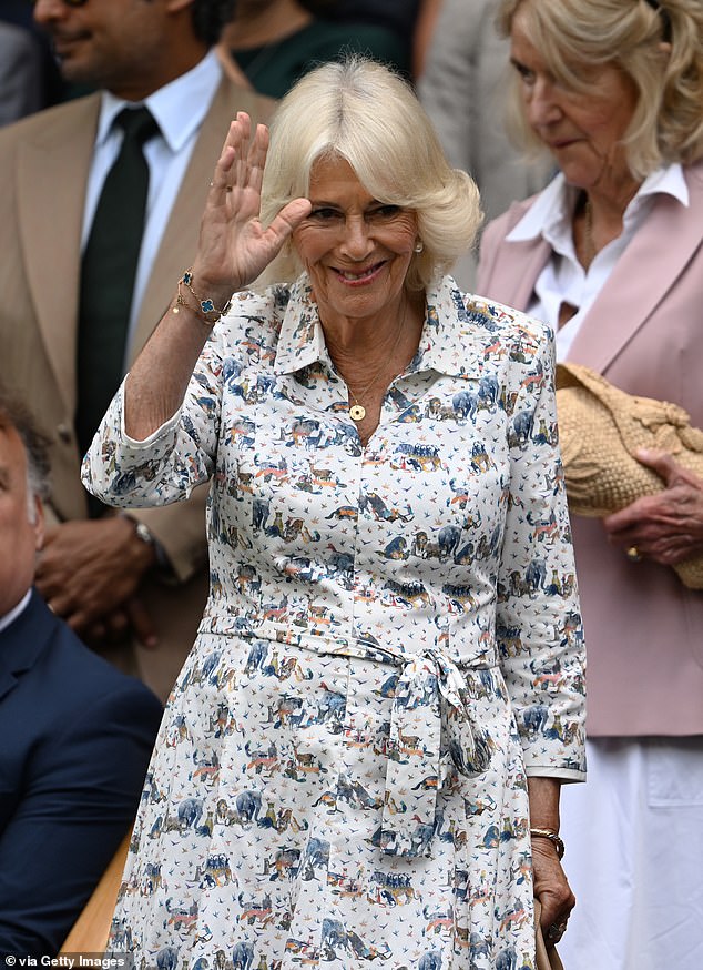 A wave to the Centre Court crowd: Queen Camilla, sporting a stylish white dress with safari animals on it, looked in good spirits as she arrived in the Royal Box at Wimbledon on Wednesday