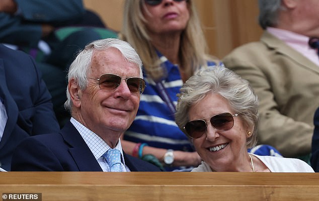 Wearing matching sunglasses the former British PM, Sir Norman Major and his wife Lady Norman Major were all smiles on Centre Court